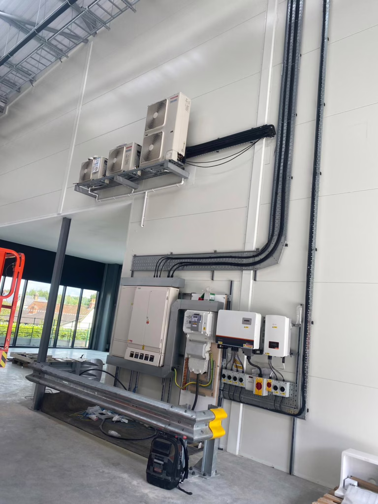 How to Choose a Commercial HVAC Contractor in the UK (2026 Guide) 1 Externally high-mounted Toshiba VRF outdoor units and refrigerant pipe runs installed by Cool Cats at Bishops Stortford industrial units